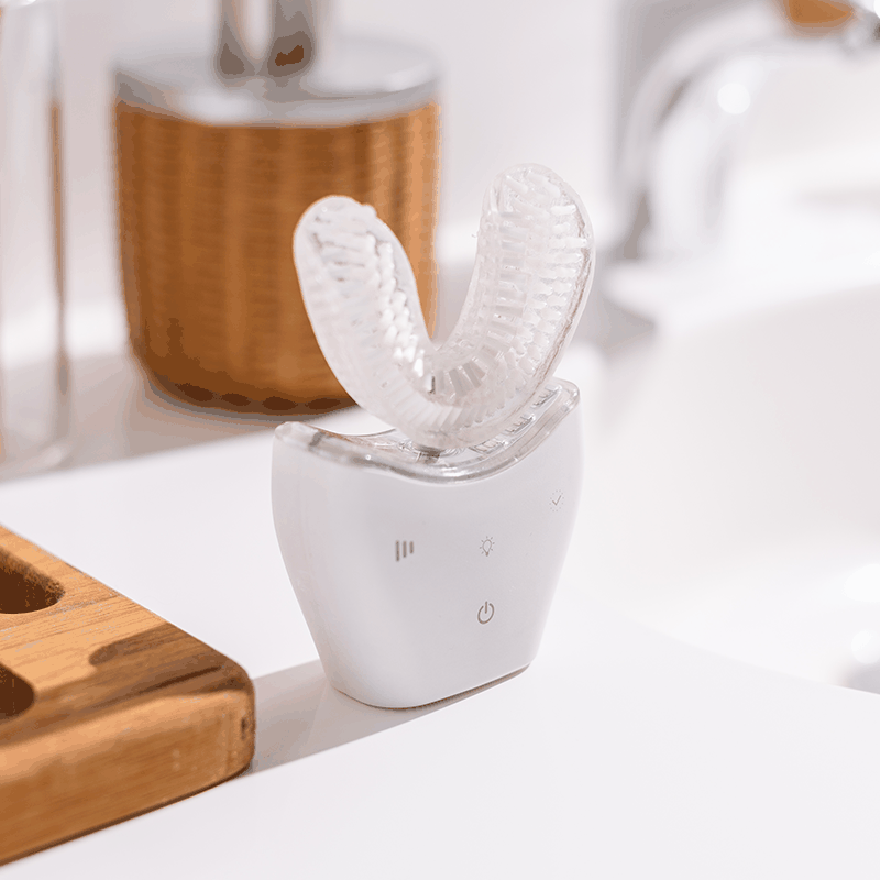 Autobrush Sonic Pro U-shaped electric toothbrush with silicone bristles on bathroom counter